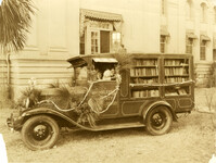 First bookmobile parked outside original Main Library located in Charleston Museum