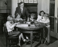 Family of readers in the Children's Room, Main Library