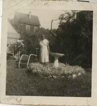 Photo of Mamie Fields standing by birdbath