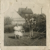 Photo of Mamie Fields sitting in yard