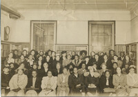 Photo of women, possibly in library