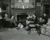 Carter family reading library books in their home