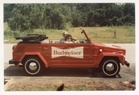 Photo of Two People in a Budweiser-Branded Car