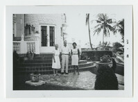 Three People Standing Outside of a House, June 1962