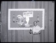 Man Posing Next to Ballantine Ale Advertisement