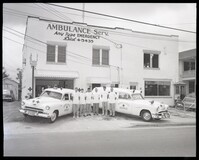 Group Photo of Ambulance Service Employees with Vehicles