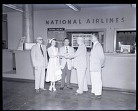 Group Photo in Front of National Airlines Counter