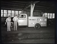 Two men Posing with Southern Ice Company Truck