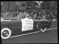 Decorated Car in a Parade with a Banner