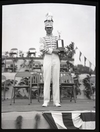 Marching Band Member Holding a Trophy