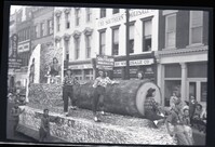 Parade Float with Women Posing with a Log