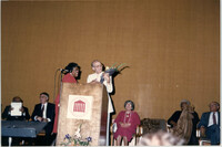 Photograph of Eugene C. Hunt Receiving Flowers at a College of Charleston Event