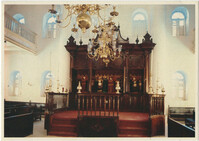 Curaçao, Netherlands Antilles. Interior of Mikve Israel-Emmanuel Synagogue, dedicated in 1732, oldest in continuous use in Western Hemisphere. View shows mahogany Hekhal (older than the building itself) containing 18 scrolls and beautiful old brass chandeliers over sand covered floor.