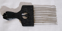 Plastic and metal hair comb