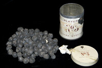 Tin of dry beans for use with nuchuba game