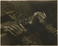 Photograph of Philip Simmons hands holding hammer and scrolled piece of iron.