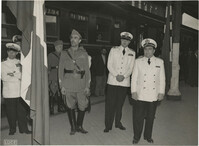 Mario Pansa and military officials at a train station, Photograph 3
