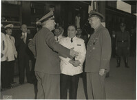 Military officials at a train station, Photograph 11