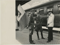 Mario Pansa and military officials at a train station, Photograph 1