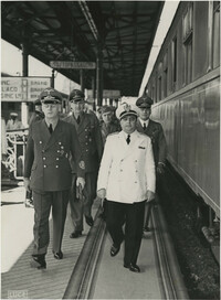 Military officials at a train station, Photograph 1
