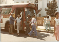 Photograph of People Exiting a Bus