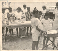Photograph of Children Serving Food