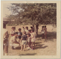 Photograph of a Group of Children and a Police Officer