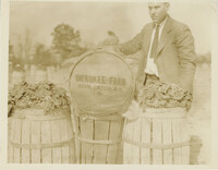 Man with Barrels of Cherokee Farm Spinach