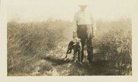 J.R. Scott in Asparagus Field with Dog