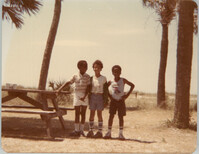 Photograph of Three Children Standing Outdoors
