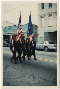 Photograph of Five Young Men Marching in a Parade