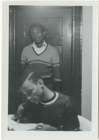 Photograph of Two Young Men Studying
