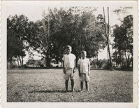 Two boys standing outside