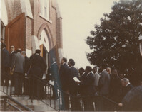 Photograph of a Group of People Walking into a Church