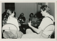 Guy Carawan Playing Guitar in Front of Class, 1960