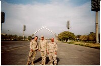 Kosovych and soldiers at the Hands of Victory monument in Baghdad