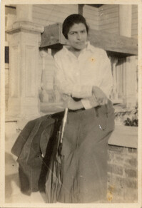 Miriam DeCosta Seabrook seated on porch