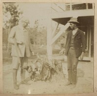 Men with string of dead raccoons