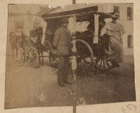 Man and woman near horse carriage