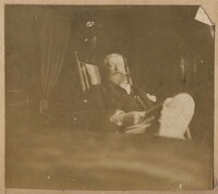 Conrad Donner sitting in chair inside house