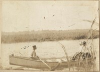 Man rowing woman in boat on the river