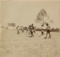 Children in field with buckets