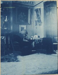 Room interior.  Lamp with beaded fringe shade.