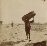 Another view of man carrying basket