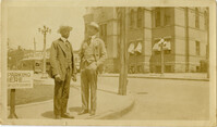 Men standing on a sidewalk