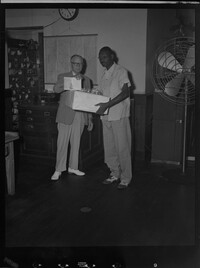 Mr. Hall presenting package to Negroe [sic] at Post Office