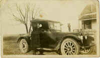 Miriam DeCosta Seabrook standing beside car