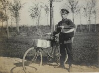 Messenger by his bicycle